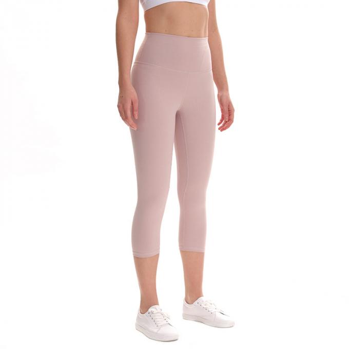 Pantalon cultivé élastique de sports de pantalons de guêtres de hanche de forme physique de yoga de femmes sans couture faites sur commande de guêtres courant les collants s'exerçants plus la taille