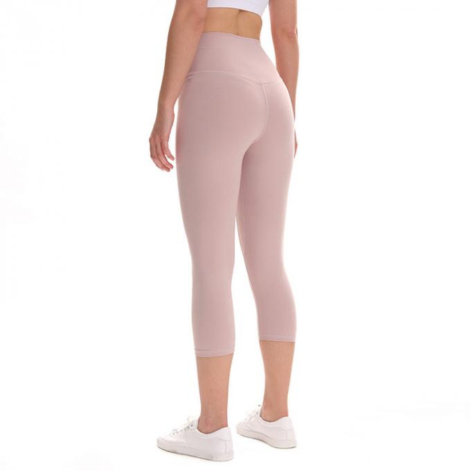 Pantalon cultivé élastique de sports de pantalons de guêtres de hanche de forme physique de yoga de femmes sans couture faites sur commande de guêtres courant les collants s'exerçants plus la taille