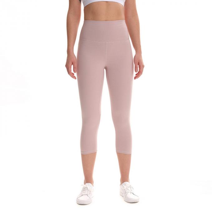 Pantalon cultivé élastique de sports de pantalons de guêtres de hanche de forme physique de yoga de femmes sans couture faites sur commande de guêtres courant les collants s'exerçants plus la taille