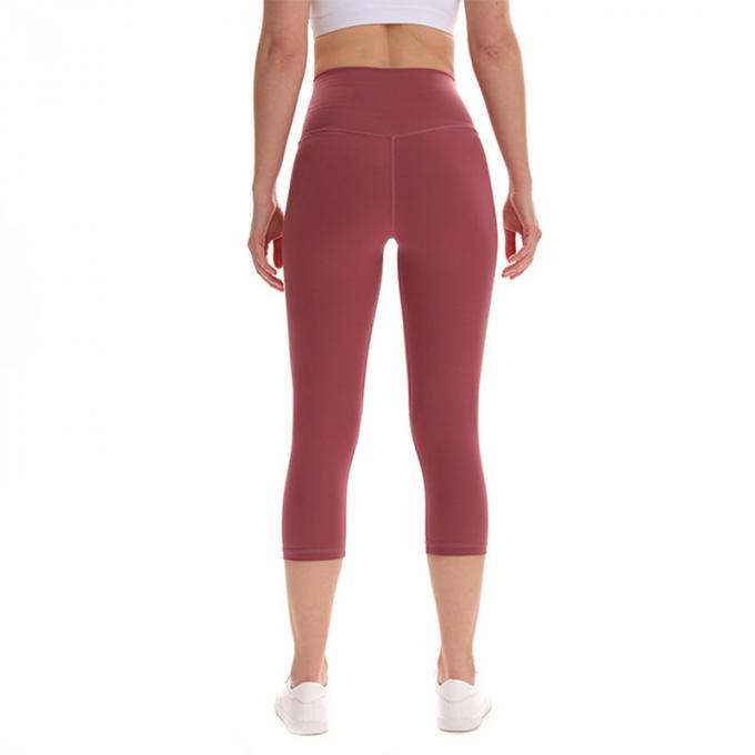 Pantalon cultivé élastique de sports de pantalons de guêtres de hanche de forme physique de yoga de femmes sans couture faites sur commande de guêtres courant les collants s'exerçants plus la taille