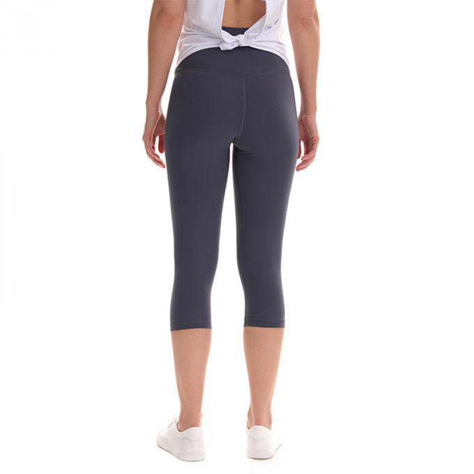Pantalon cultivé élastique de sports de pantalons de guêtres de hanche de forme physique de yoga de femmes sans couture faites sur commande de guêtres courant les collants s'exerçants plus la taille