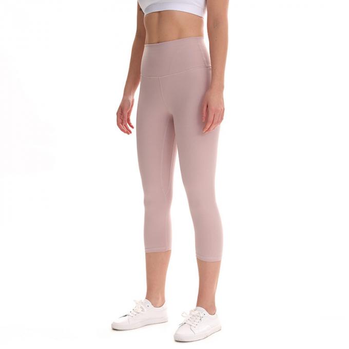 Pantalon cultivé élastique de sports de pantalons de guêtres de hanche de forme physique de yoga de femmes sans couture faites sur commande de guêtres courant les collants s'exerçants plus la taille