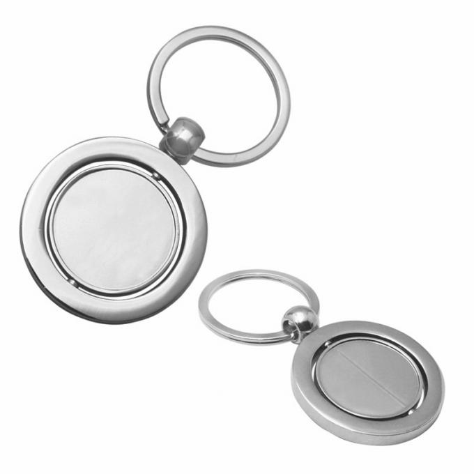 Le porte-clés vide tournant promotionnel fait sur commande de voiture en métal a adapté la chaîne aux besoins du client principale en alliage de zinc de forme ronde