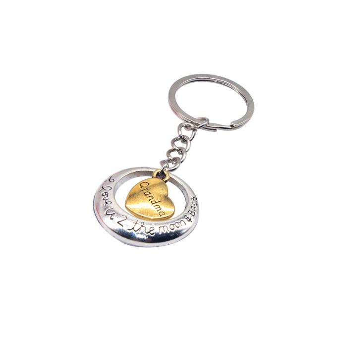 la coutume vend le métal en gros en alliage de zinc de nouveau beau de coeur de forme cadeau créatif de voiture keychian